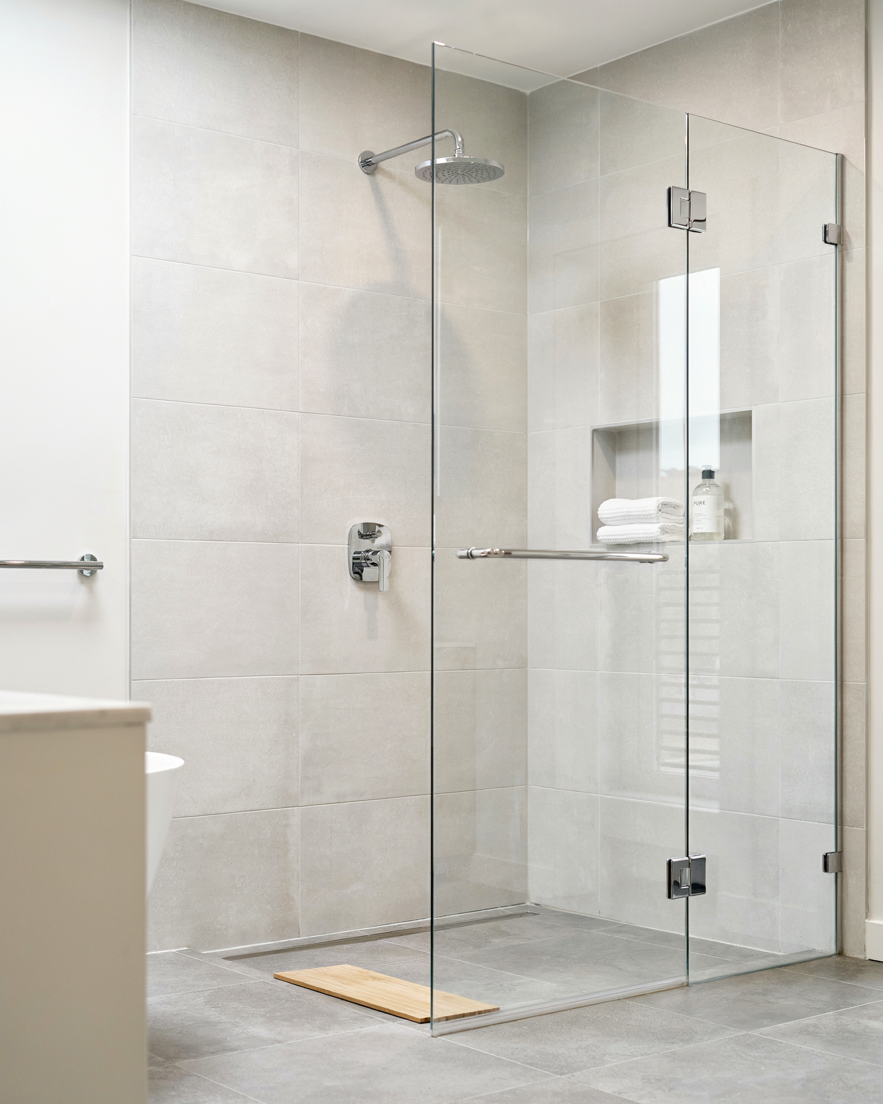 Silicone sealant around a shower enclosure